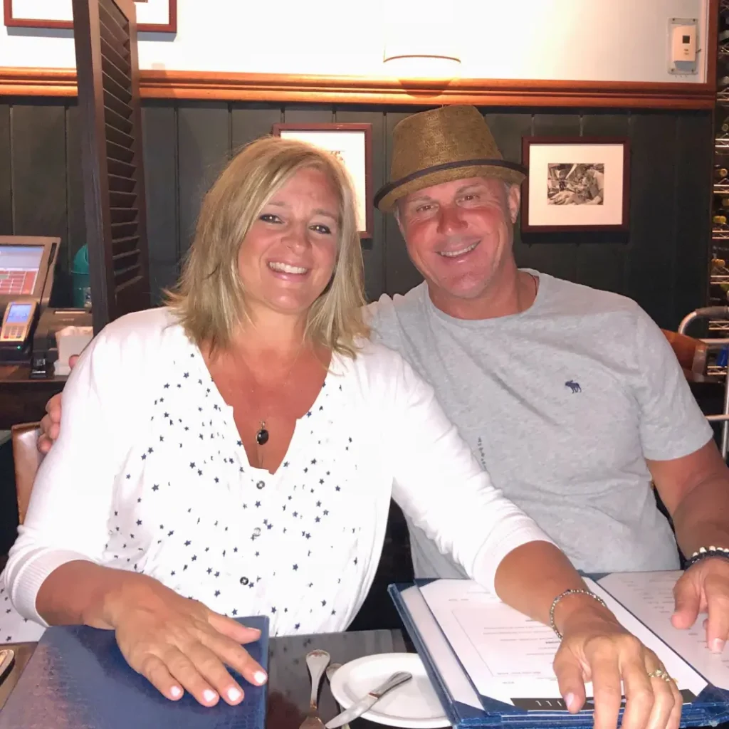 Colleen and Wally, owners of Homemade by Colleen, seated together.